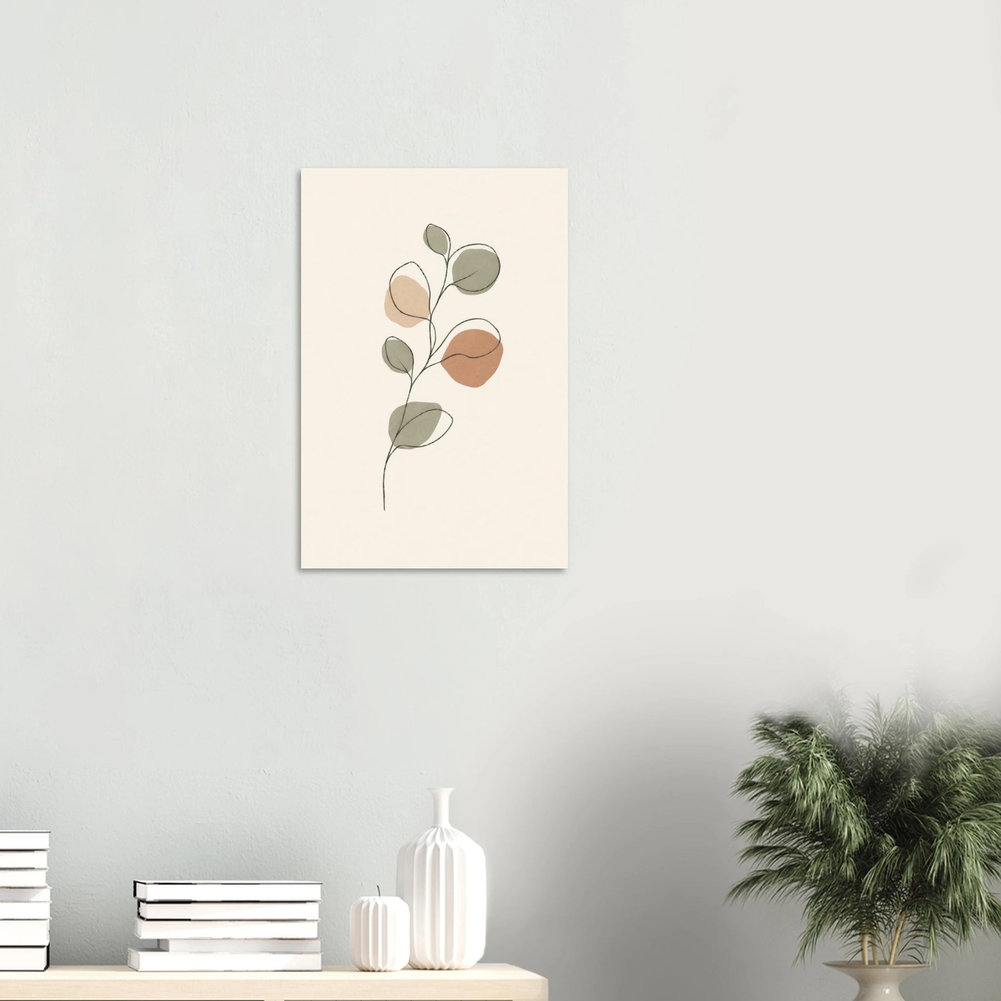 Eucalyptus Branch nursery print on a white wall above a shelf with books and vases
