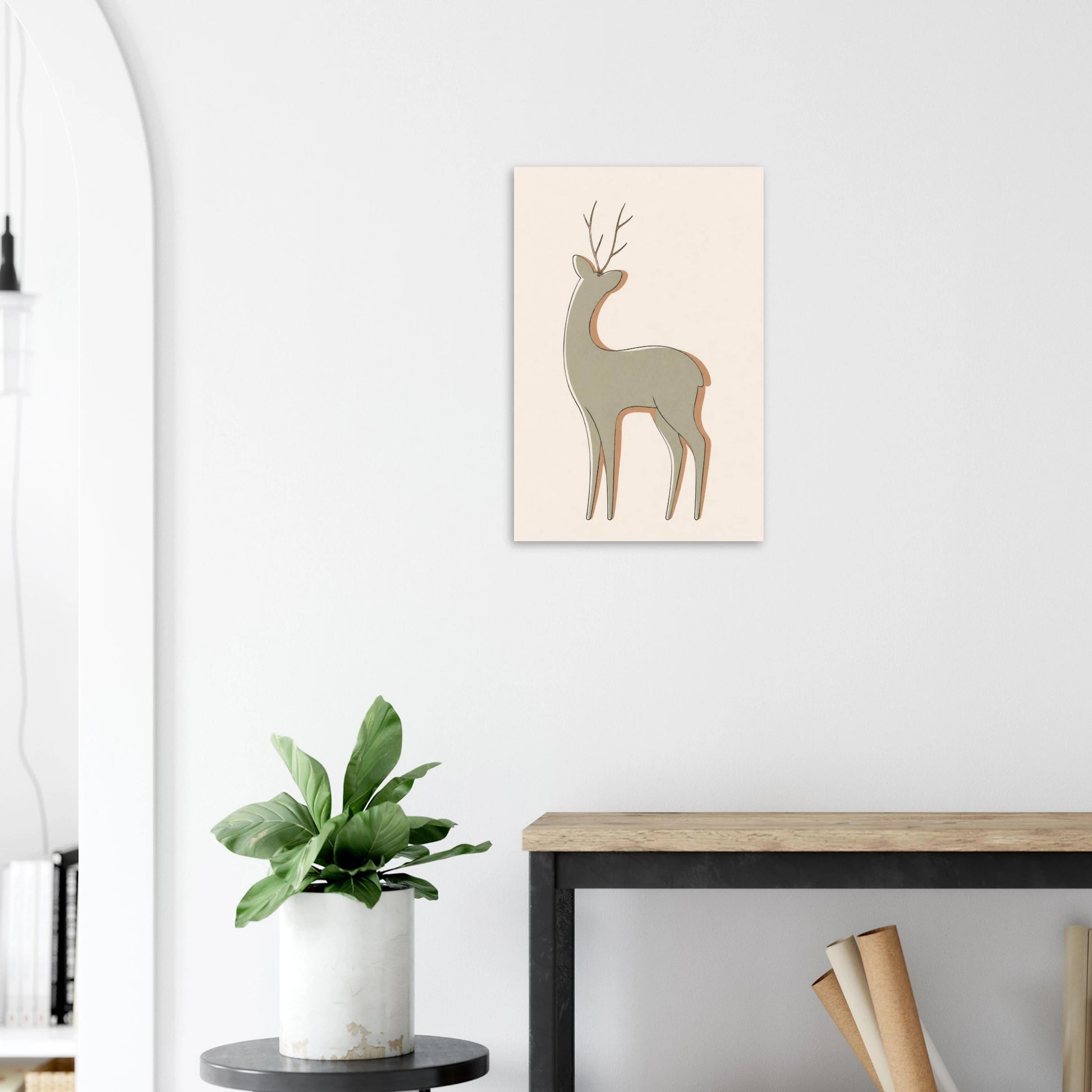 Little Deer nursery print on a white wall above a wooden bench with a plant