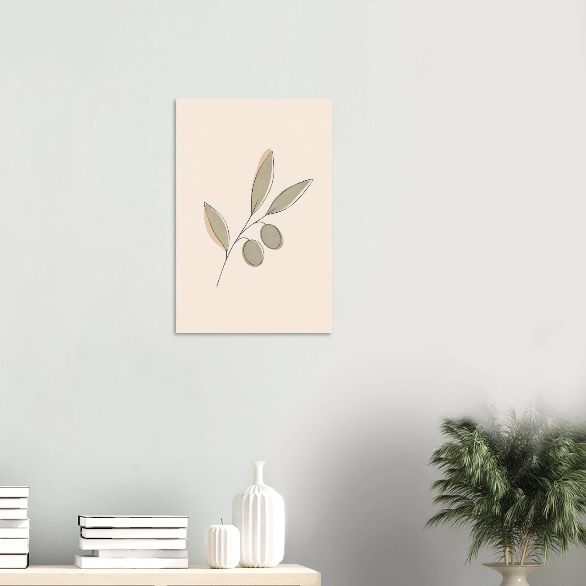 Olive Sprig nursery print on a white wall above a shelf with books and vases