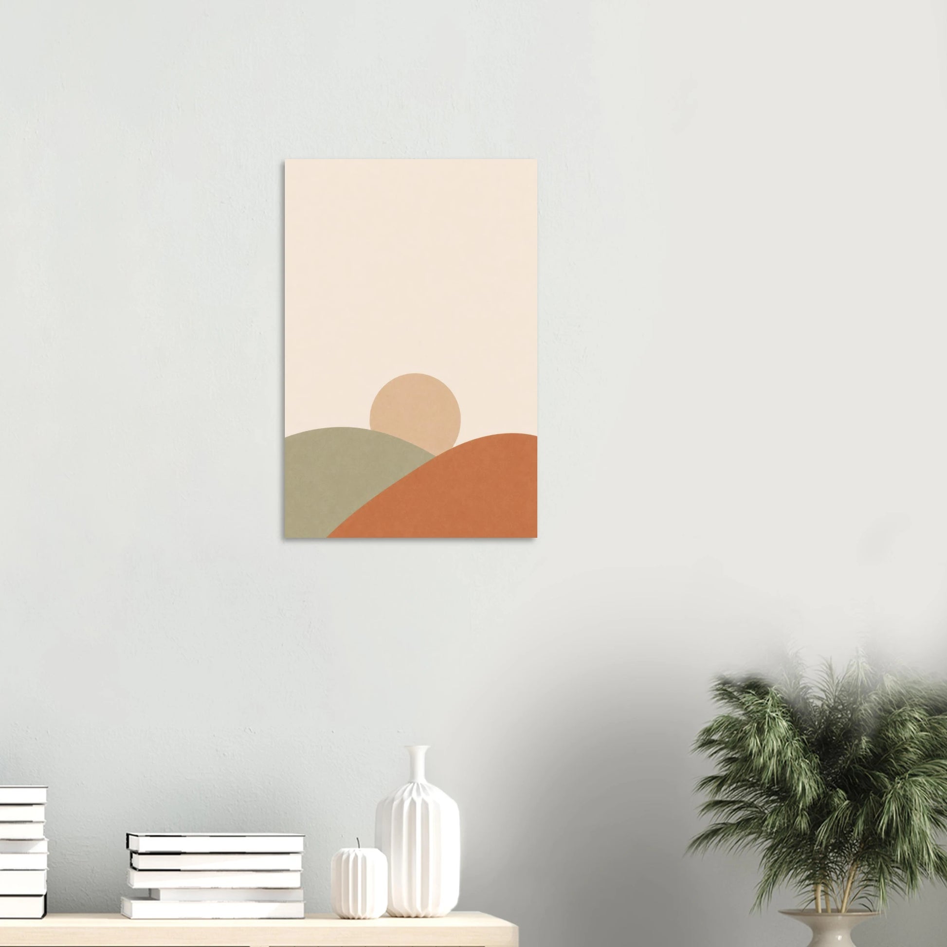Sun & Hills nursery print on a white wall above a shelf with books and vases