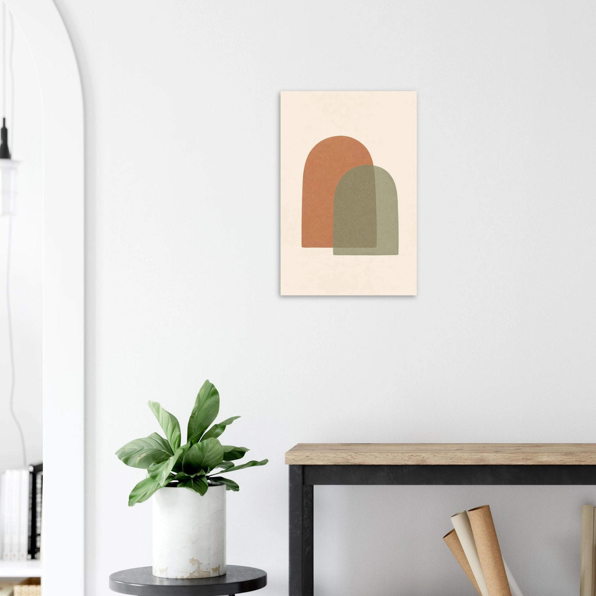 Terracotta & Sage Arches nursery print on a white wall above a wooden bench with a plant