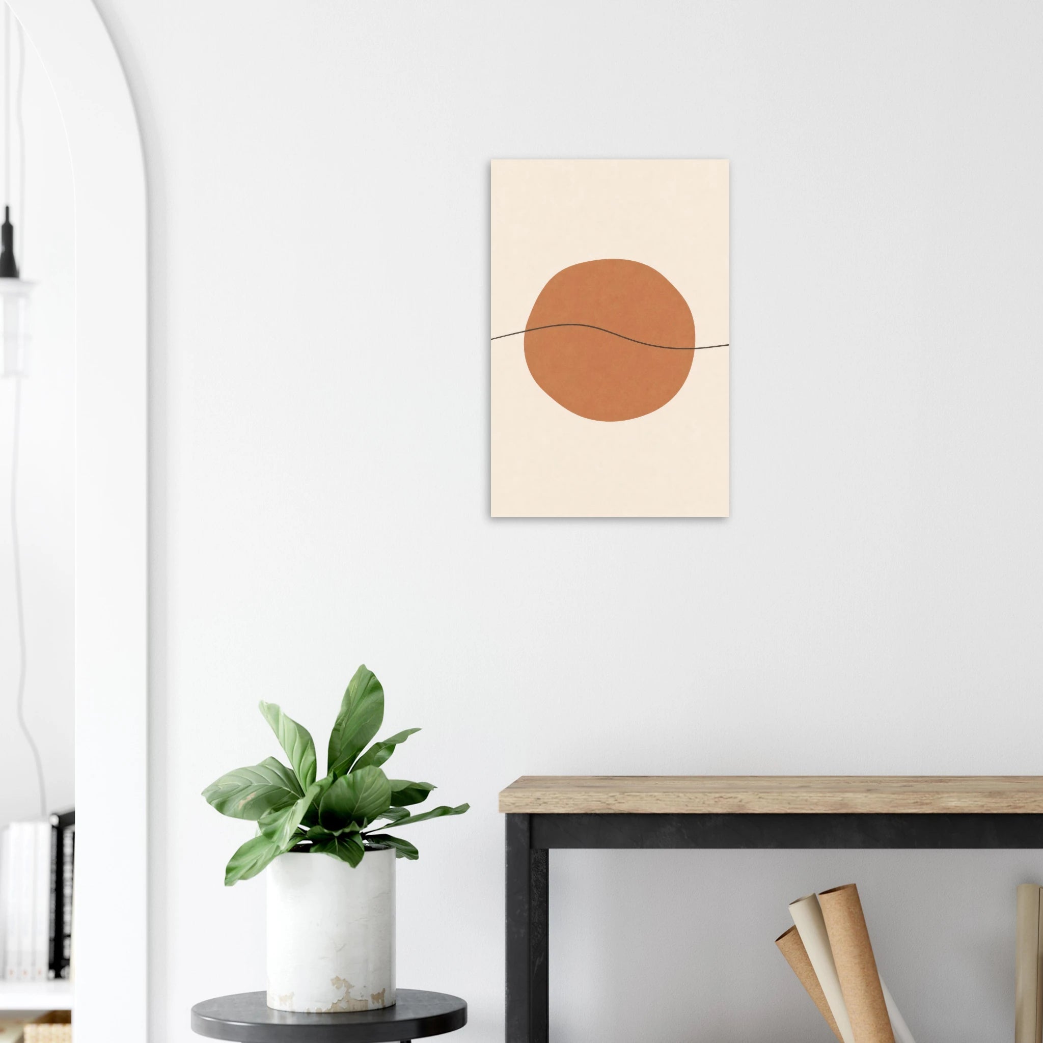 Terracotta Sun & Line nursery print on a white wall above a wooden bench with a plant